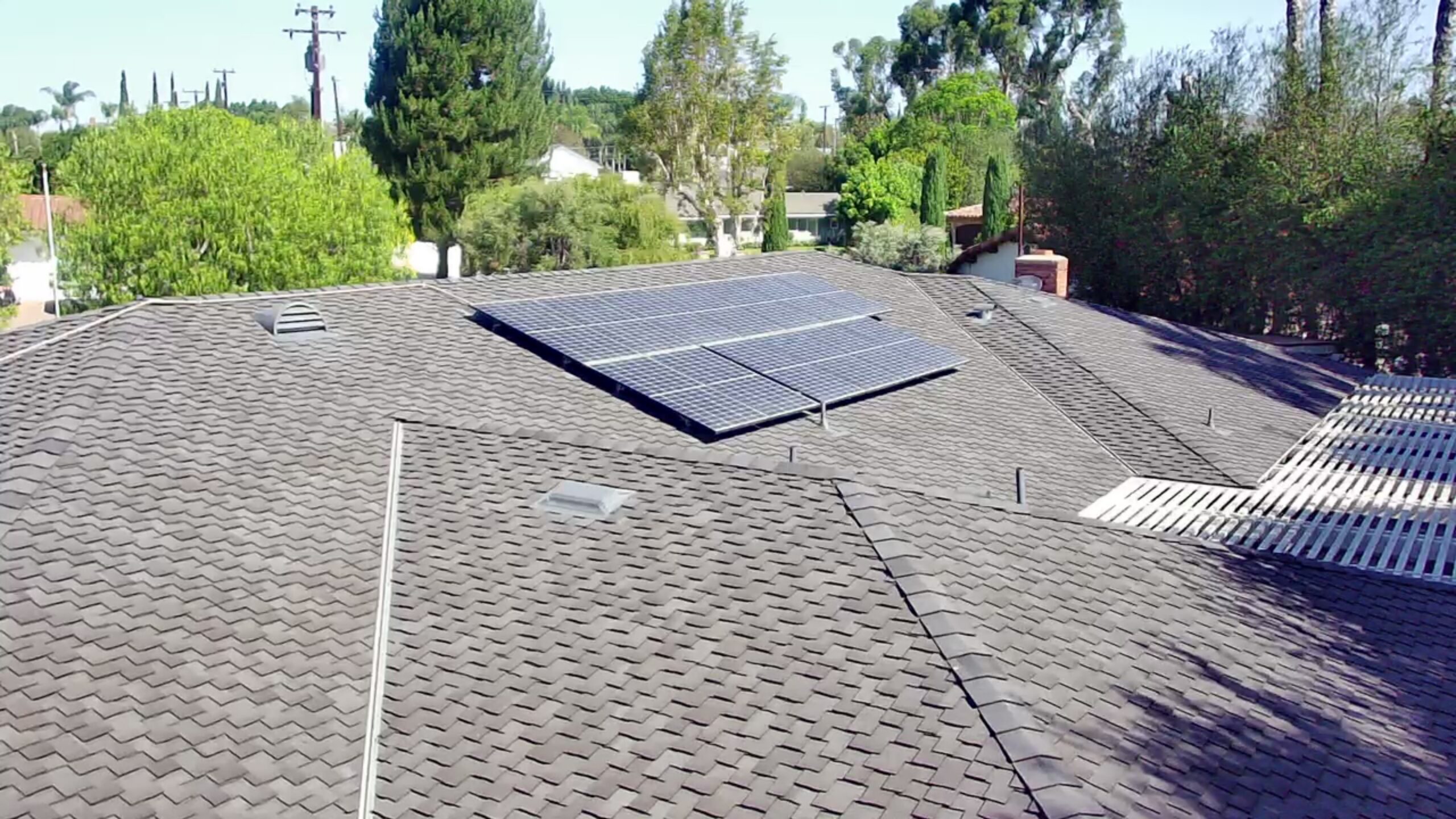 Solar panels installed on a shingle roof